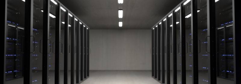 Rows of server cabinets in a data center hall